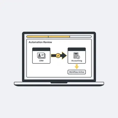 _ A small business owner reviewing an automation workflow on a laptop, with a simple flowchart visible on screen showing data moving from a CRM to an accounting tool